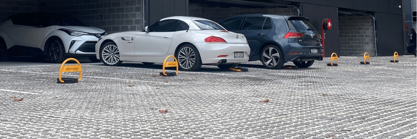 thatsmyspot remote-control-parking-bollards-installed-at-commercial-property-site-goodman-rosebery-engine-yards thatsmyspot parking bollards for for visitor parking and commercial parking and industrial parking and hotel parking with logos and wide angle view