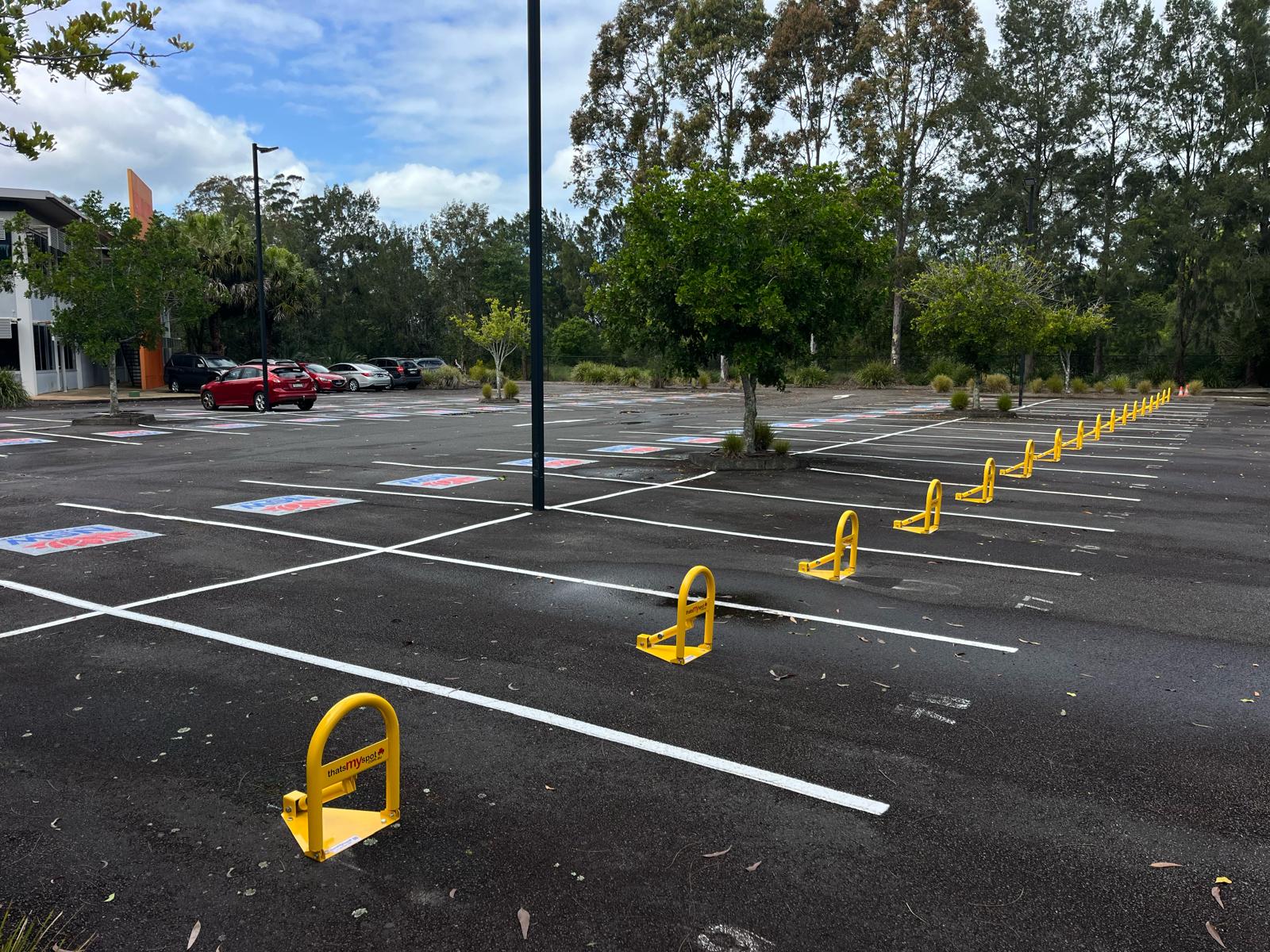thatsmyspot Manual parking bollard installed at Cushman & Wakefield property in 2024, enhancing secure parking management and access control. thatsmyspot parking bollards for visitor parking and commercial parking and industrial parking and hotel parking and EV charging